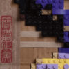 Asian girl in lego inlayed in lego closeup